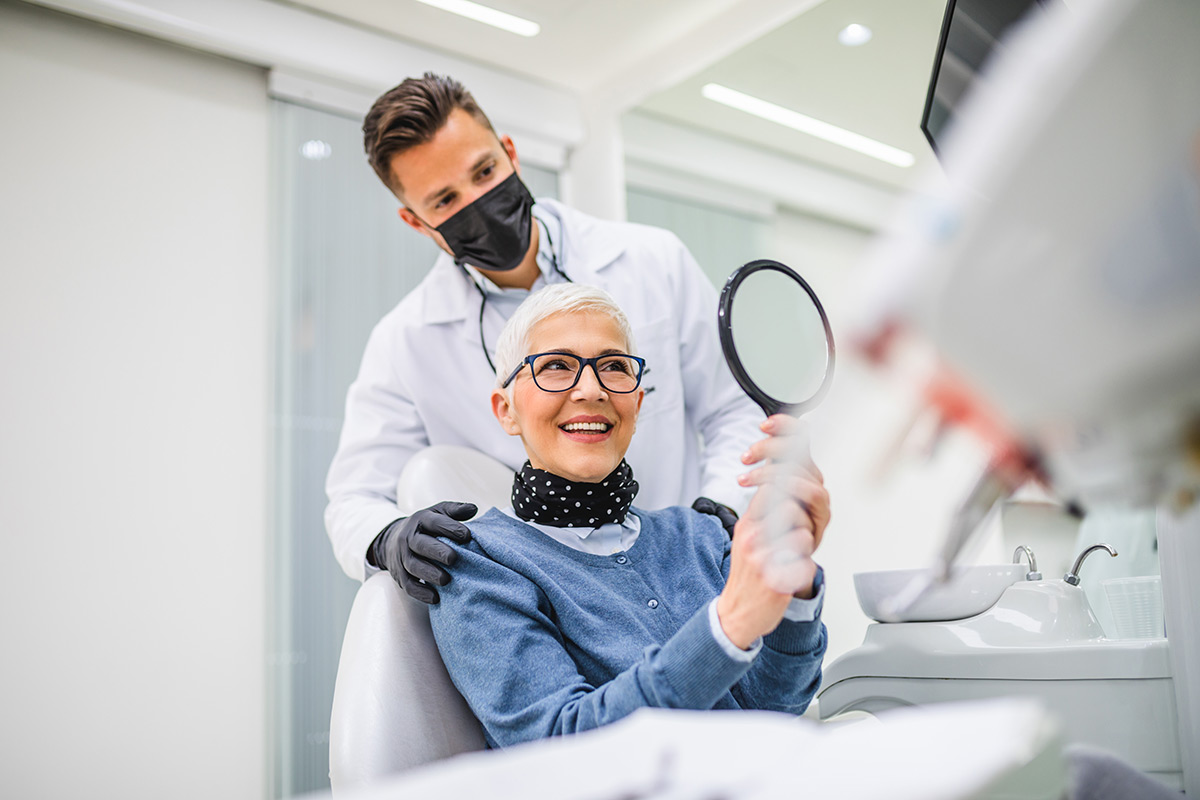 Dental professional examining a patient for periodontal care