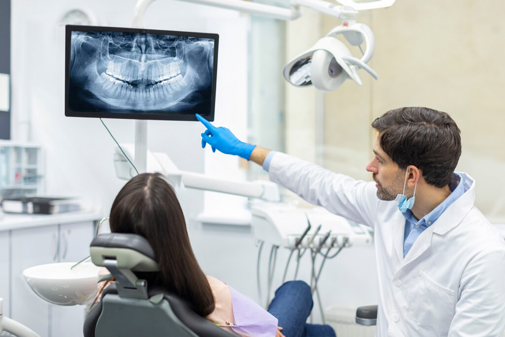Dental professional providing specialty periodontal care